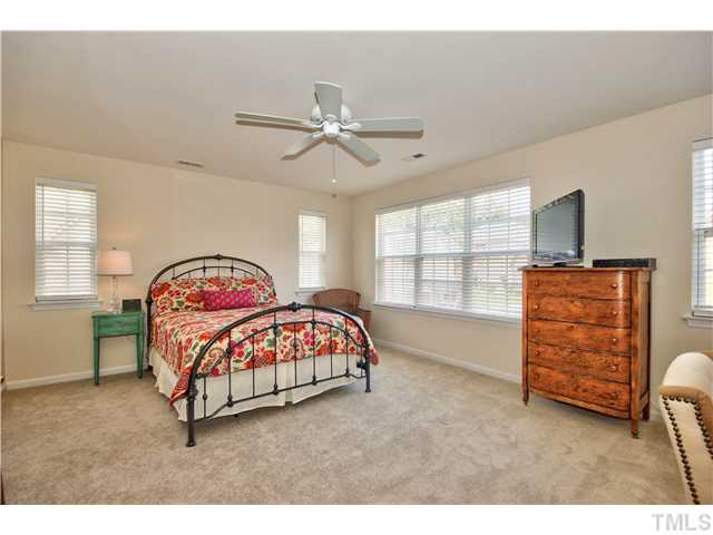 9827 Layla Avenue Raleigh, NC 27617 - Photo 12 of 20 a bedroom with a bed and window