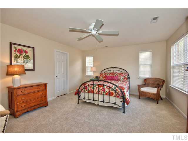 9827 Layla Avenue Raleigh, NC 27617 - Photo 13 of 20 a bedroom with furniture and a window