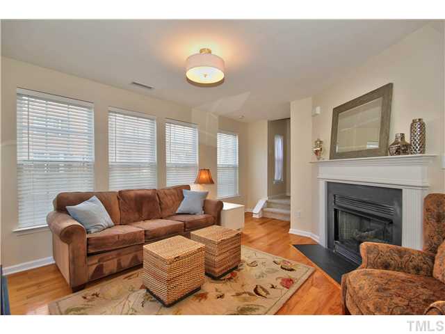9827 Layla Avenue Raleigh, NC 27617 - Photo 4 of 20 a living room with furniture and a fireplace