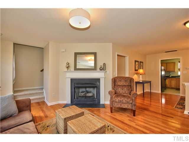 9827 Layla Avenue Raleigh, NC 27617 - Photo 5 of 20 a living room with furniture and a fireplace