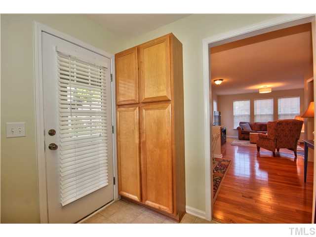 9827 Layla Avenue Raleigh, NC 27617 - Photo 8 of 20 a view of livingroom with furniture wooden floor and windows
