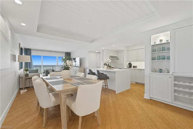 a bedroom with a bed and a potted plant