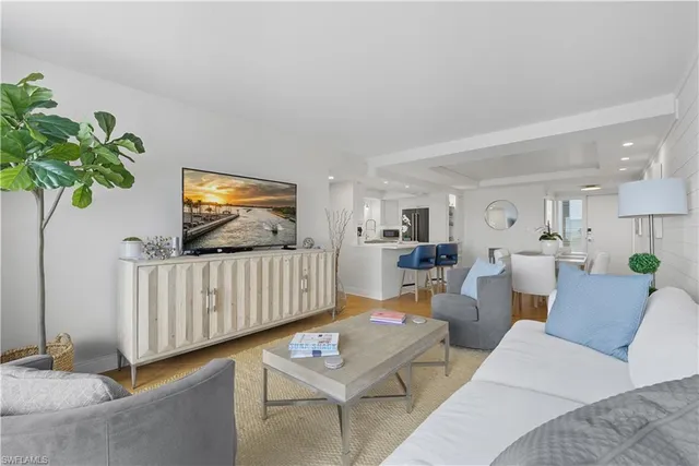 a bedroom with a bed and a night stand