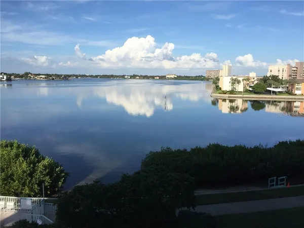 a view of a lake in middle of the house