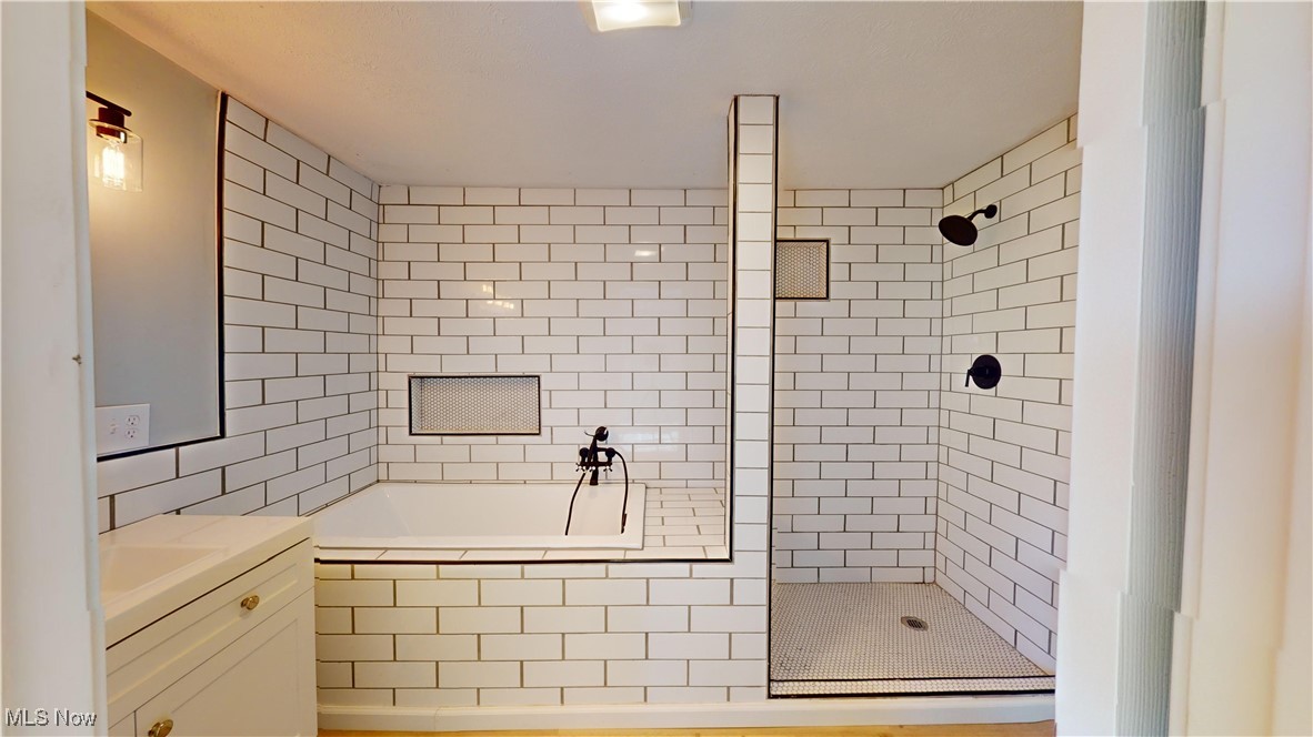 15245 Georgia Road Middlefield, OH 44062 - Photo 19 of 35 Bathroom with vanity and plus walk in shower