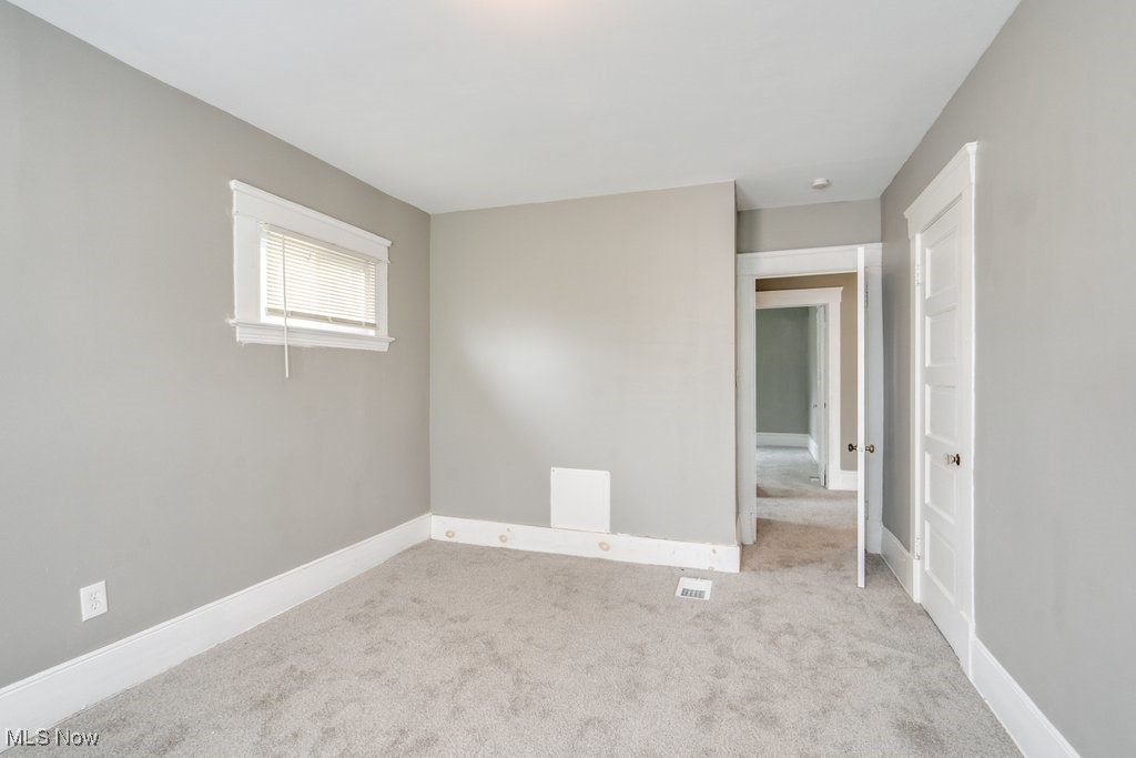 1261 Rozelle Avenue Cleveland, OH 44112 - Photo 24 of 32 Unfurnished room featuring light carpet