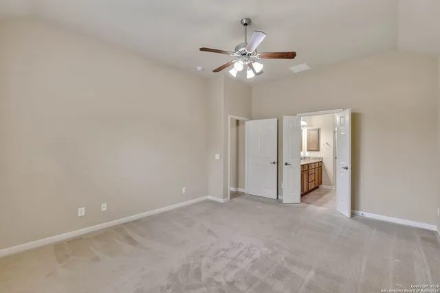 a view of a livingroom with a chandelier fan