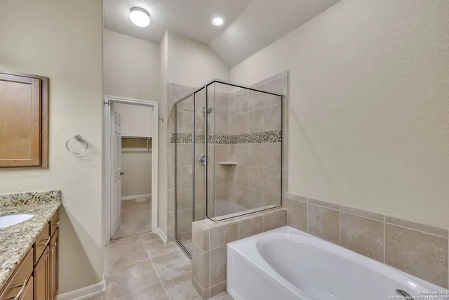 a bathroom with a tub and shower