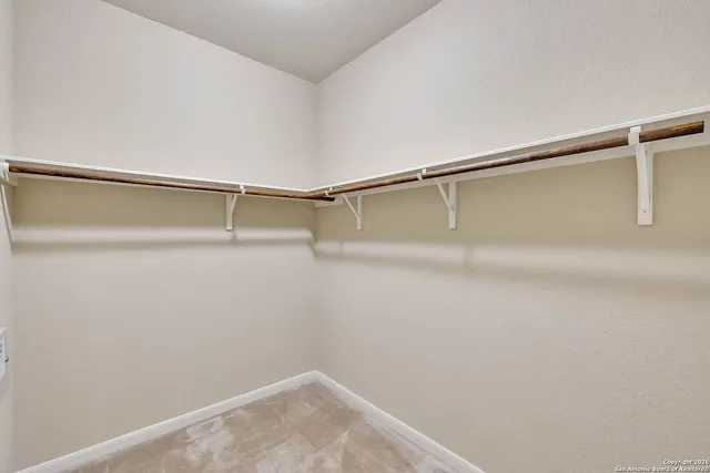 a view of a room with racks on the wall