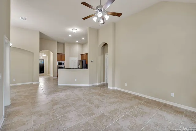 a view of a kitchen with a sink and a refrigerator