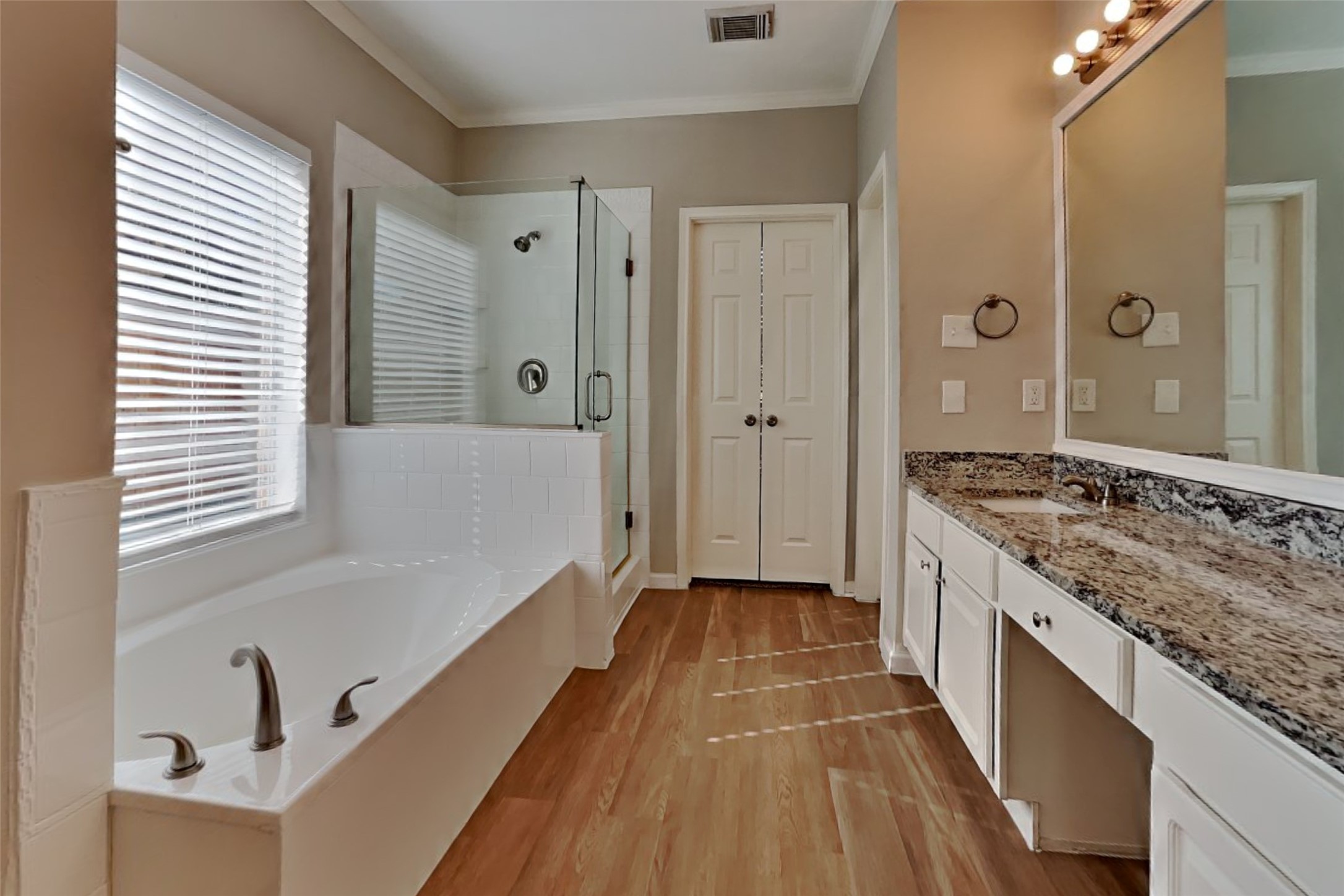 30110 Granum Drive Spring, TX 77386 - Photo 13 of 22 a spacious bathroom with a granite countertop sink a mirror and a bathtub