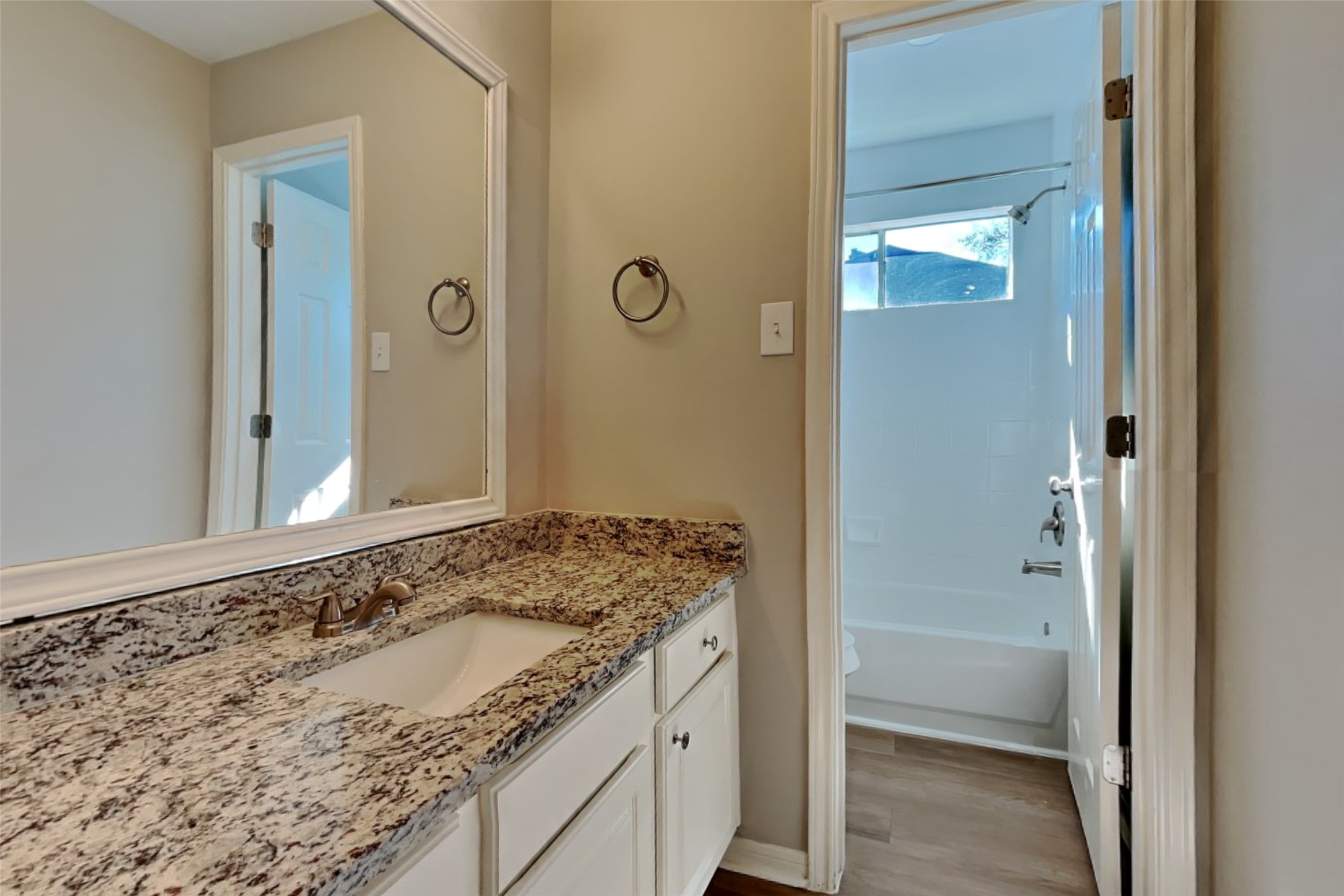 30110 Granum Drive Spring, TX 77386 - Photo 18 of 22 a bathroom with a granite countertop sink and a mirror