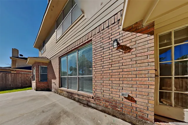 a view of wooden house with a street