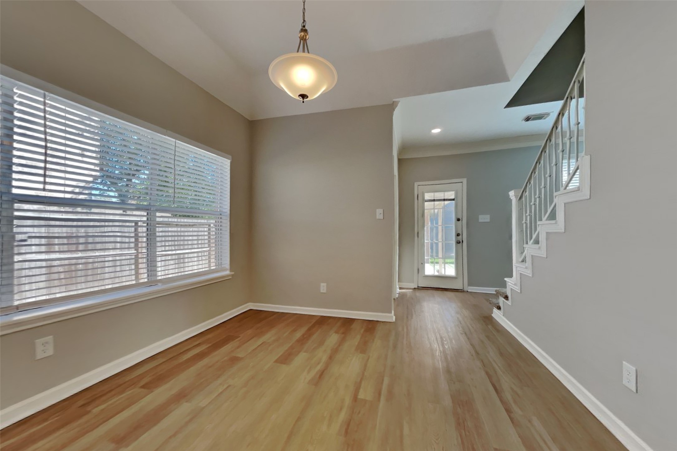 30110 Granum Drive Spring, TX 77386 - Photo 8 of 22 a view of an empty room with wooden floor and a window