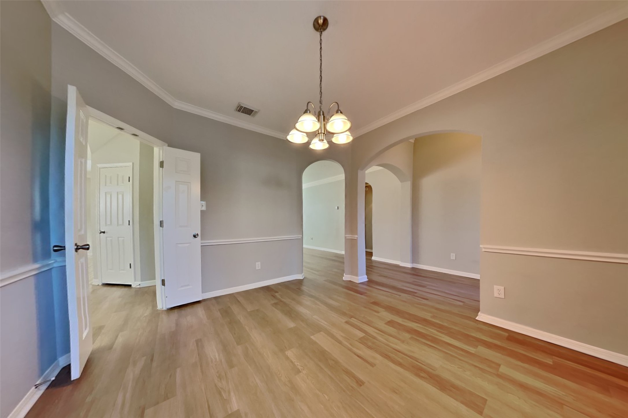 30110 Granum Drive Spring, TX 77386 - Photo 9 of 22 a view of a chandelier in big room with wooden floor
