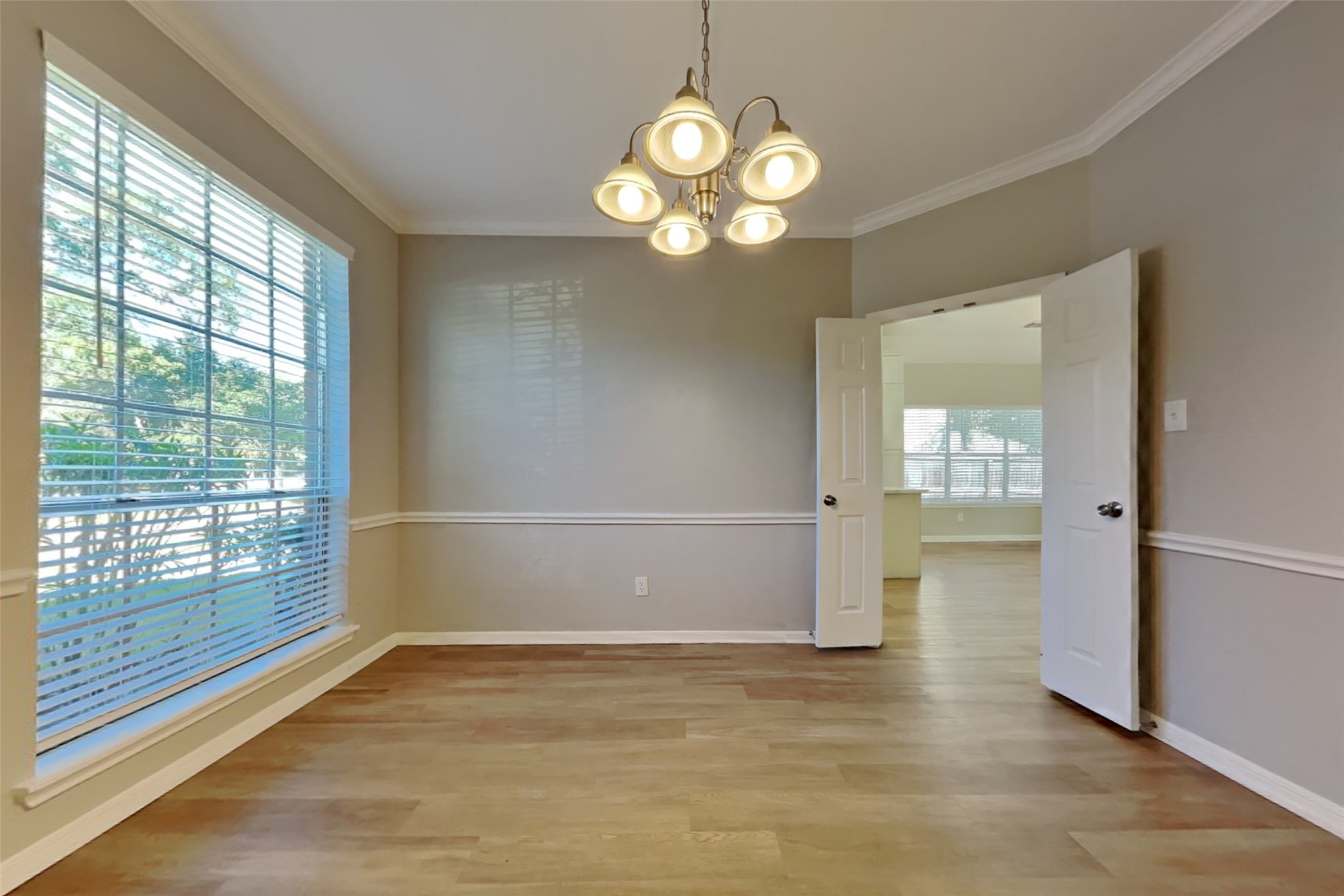 30110 Granum Drive Spring, TX 77386 - Photo 10 of 22 a view of an empty room with wooden floor and a window