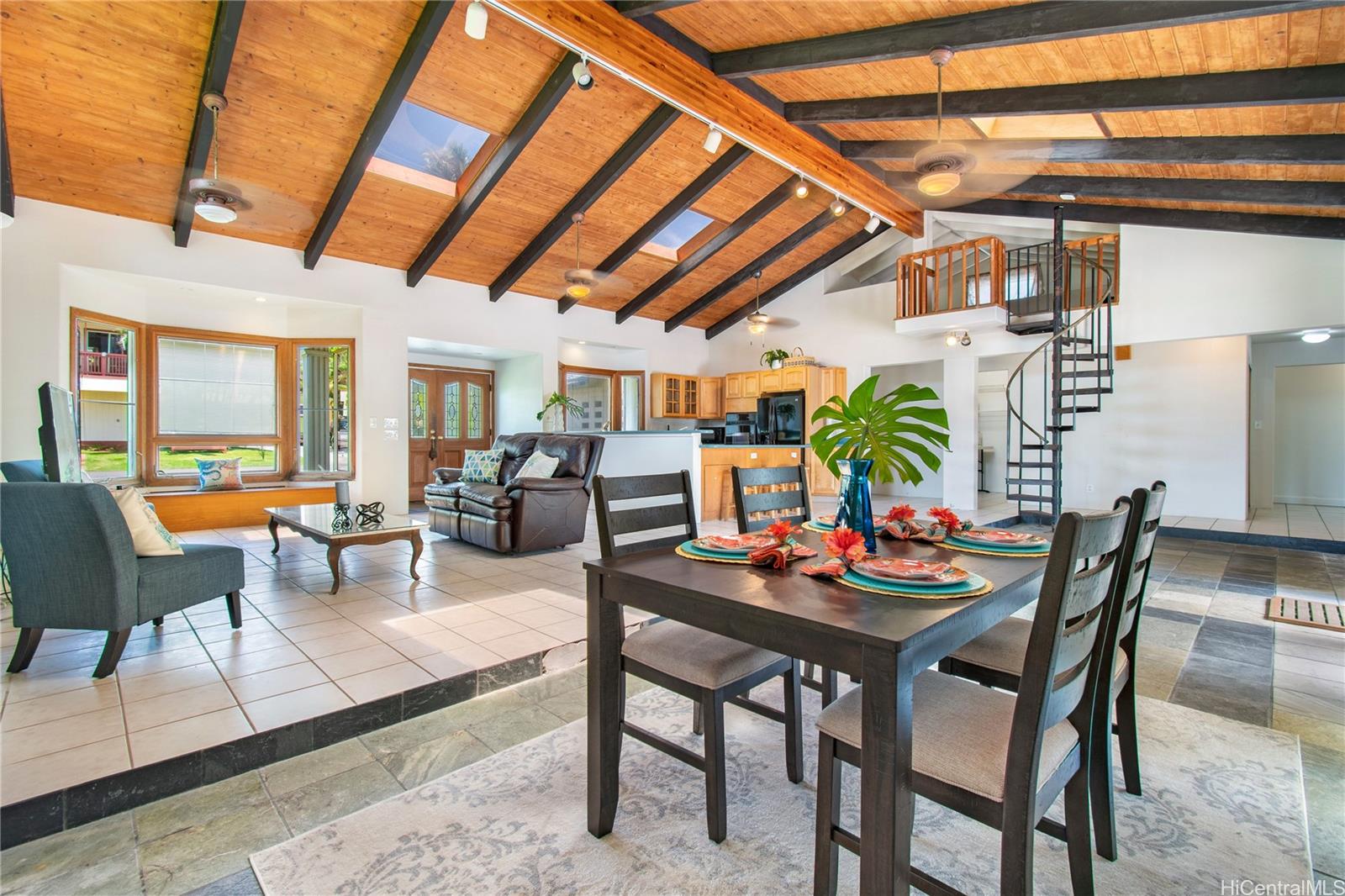 a view of a dining room with furniture and a rug