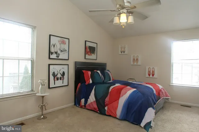 a bed room with a bed and a window