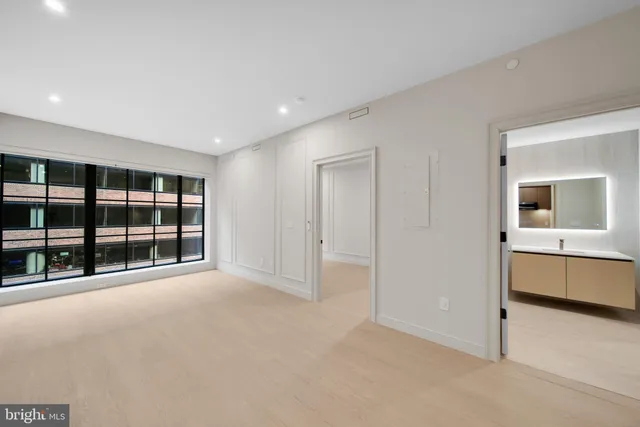 a view of an empty room with a window