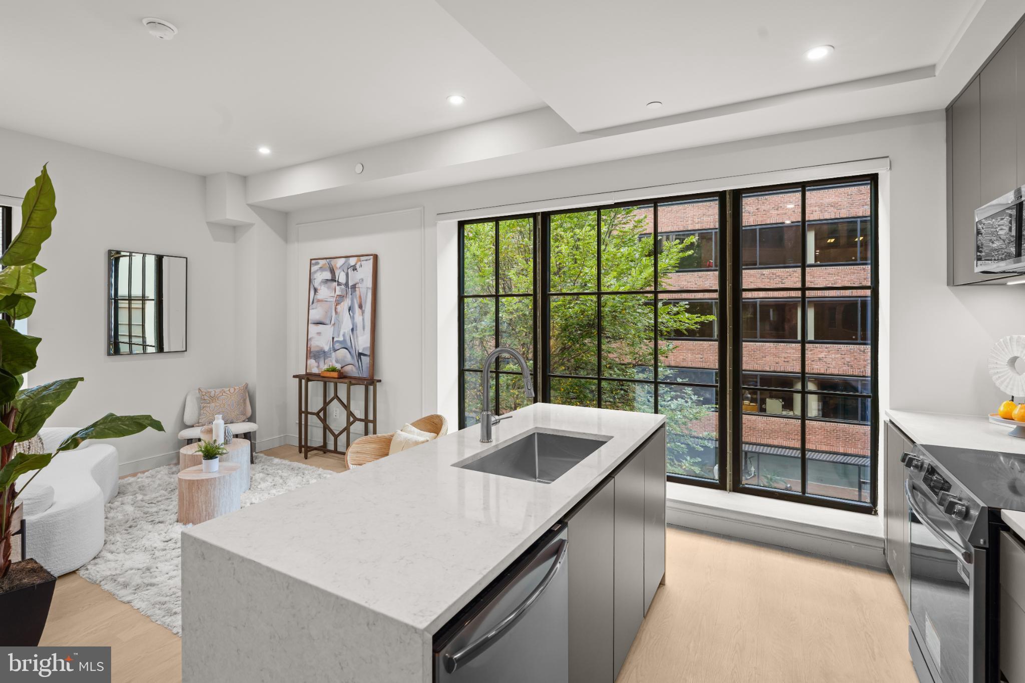 2121 Ward Place Northwest, Unit 304 Washington, DC 20037 - Photo 6 of 20 a kitchen with a sink and large window
