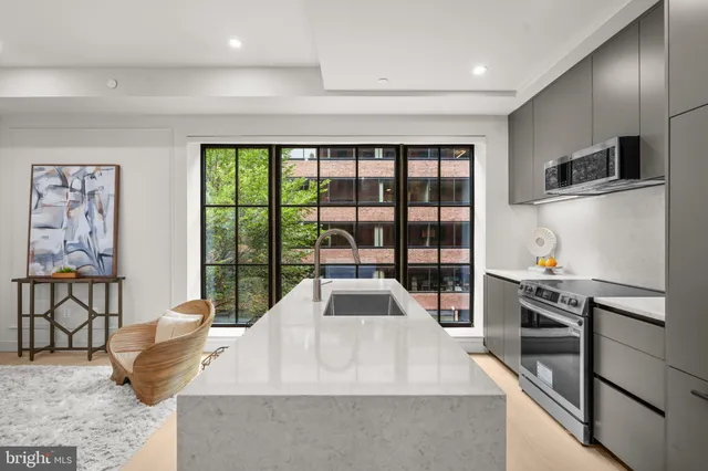 a view of kitchen with furniture and large window
