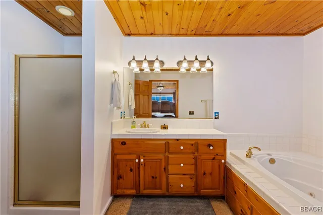 a bathroom with a sink a vanity and a mirror