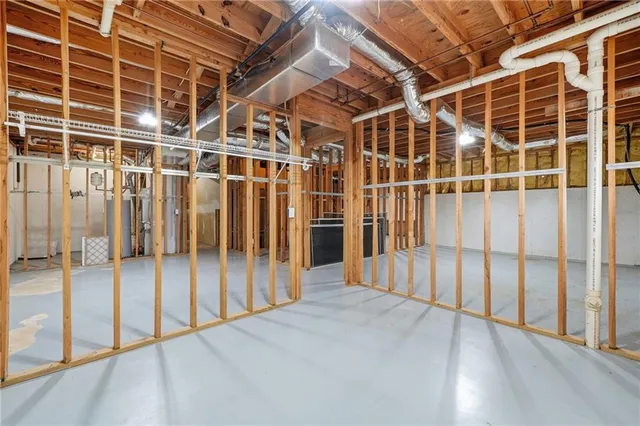 a bathroom with a sink a toilet and a shower