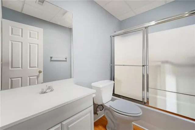 a picture of a bench in front of a house