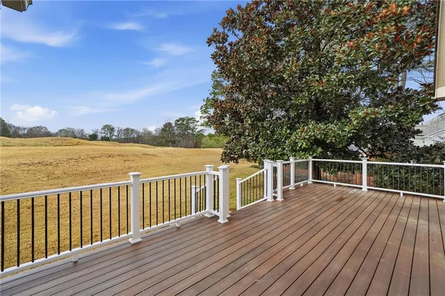 a front view of a house with swimming pool and sitting area