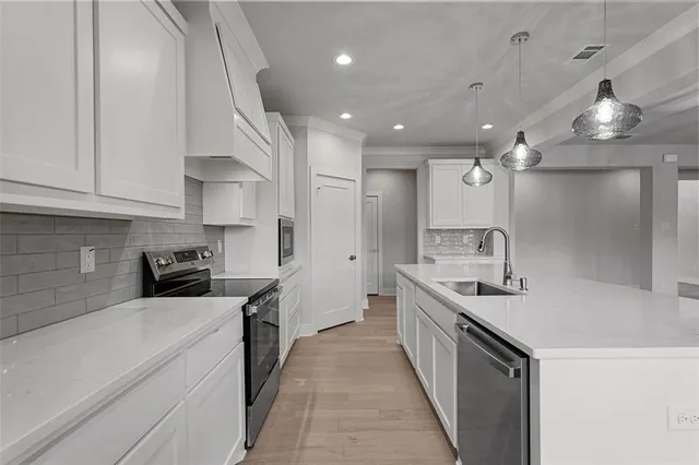 a kitchen with a sink and counter top space