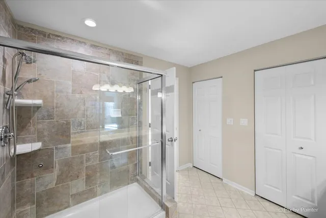 a bathroom with a glass shower door