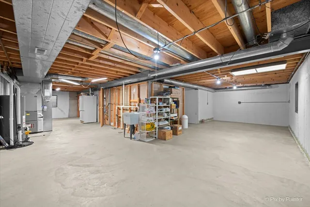 a view of a room with wooden ceiling