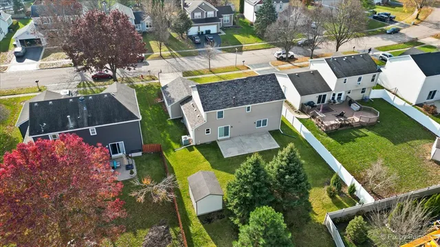 an aerial view of house with yard