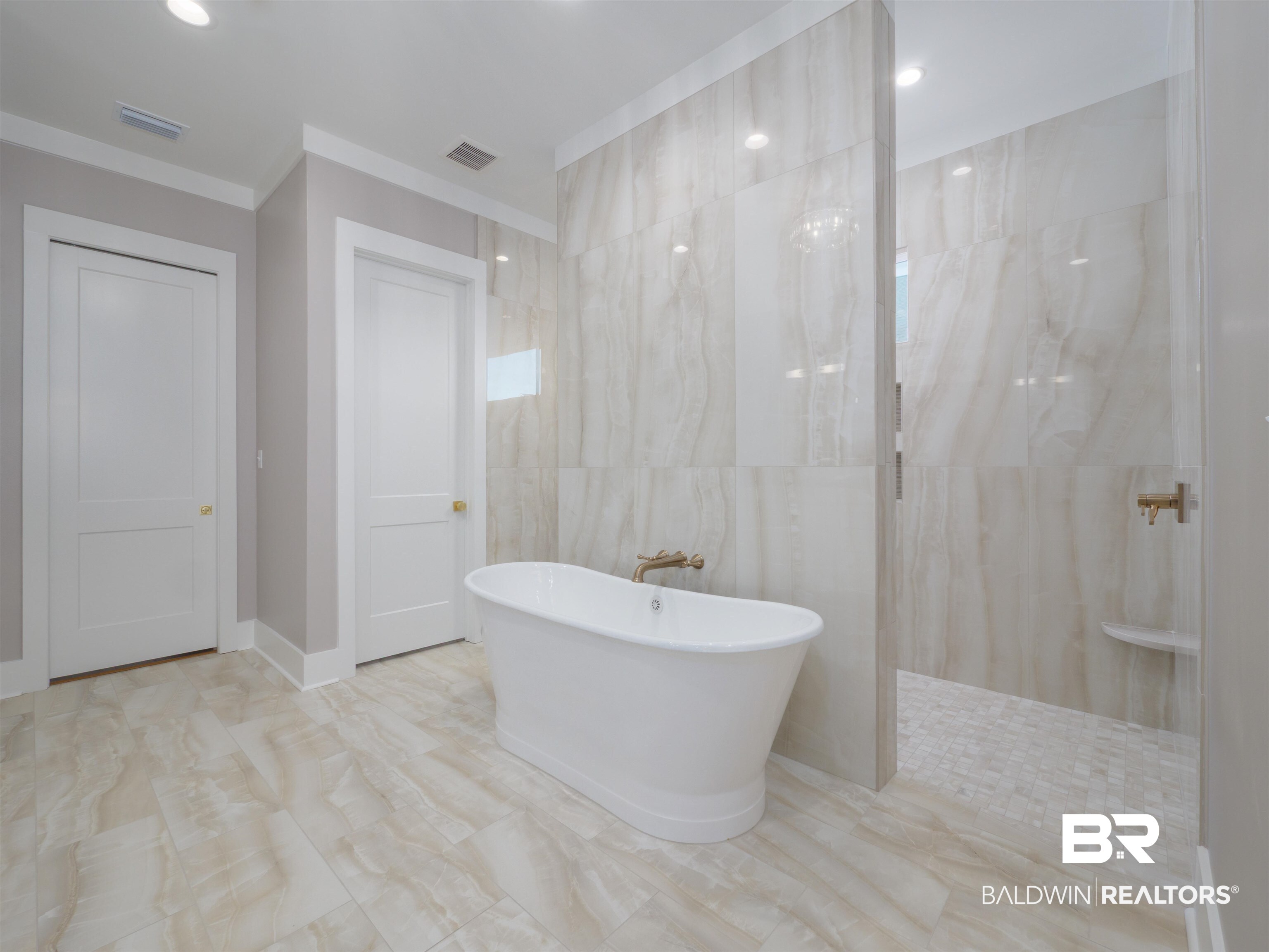 10912 Catania Avenue Fairhope, AL 36532 - Photo 21 of 54 Tiled bathroom with standalone tub and dual entry shower