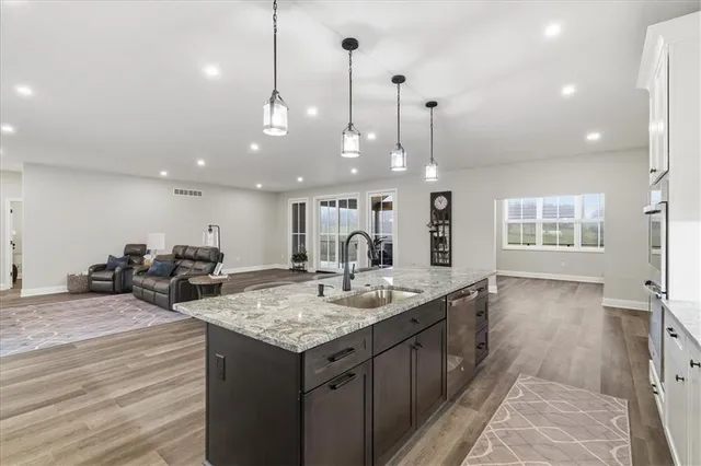 a workspace with wooden floor and white cabinet