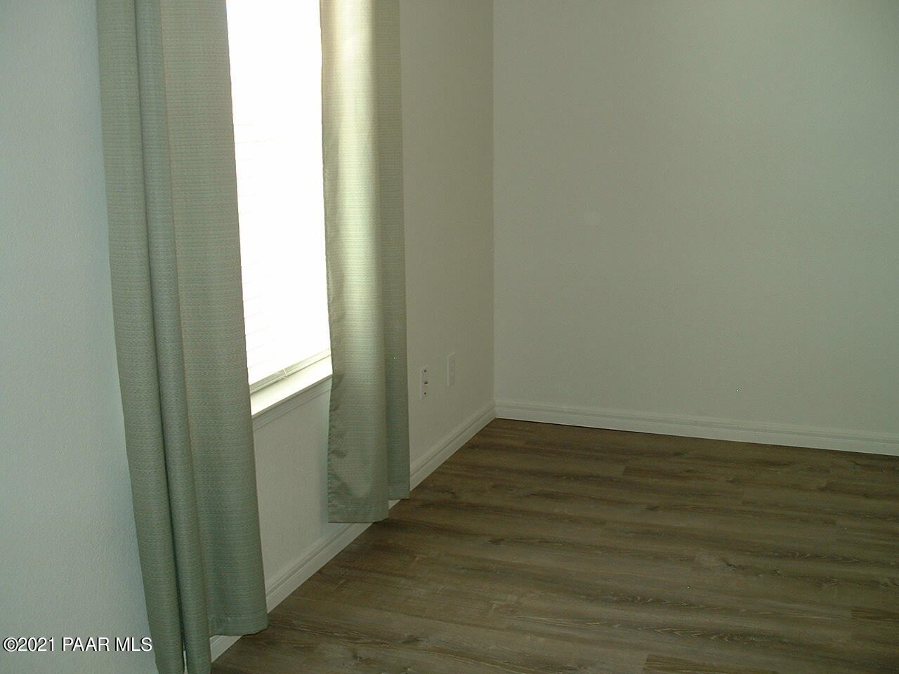 25 West Antelope Run Road Paulden, AZ 86334 - Photo 16 of 27 a view of an empty room and wooden floor