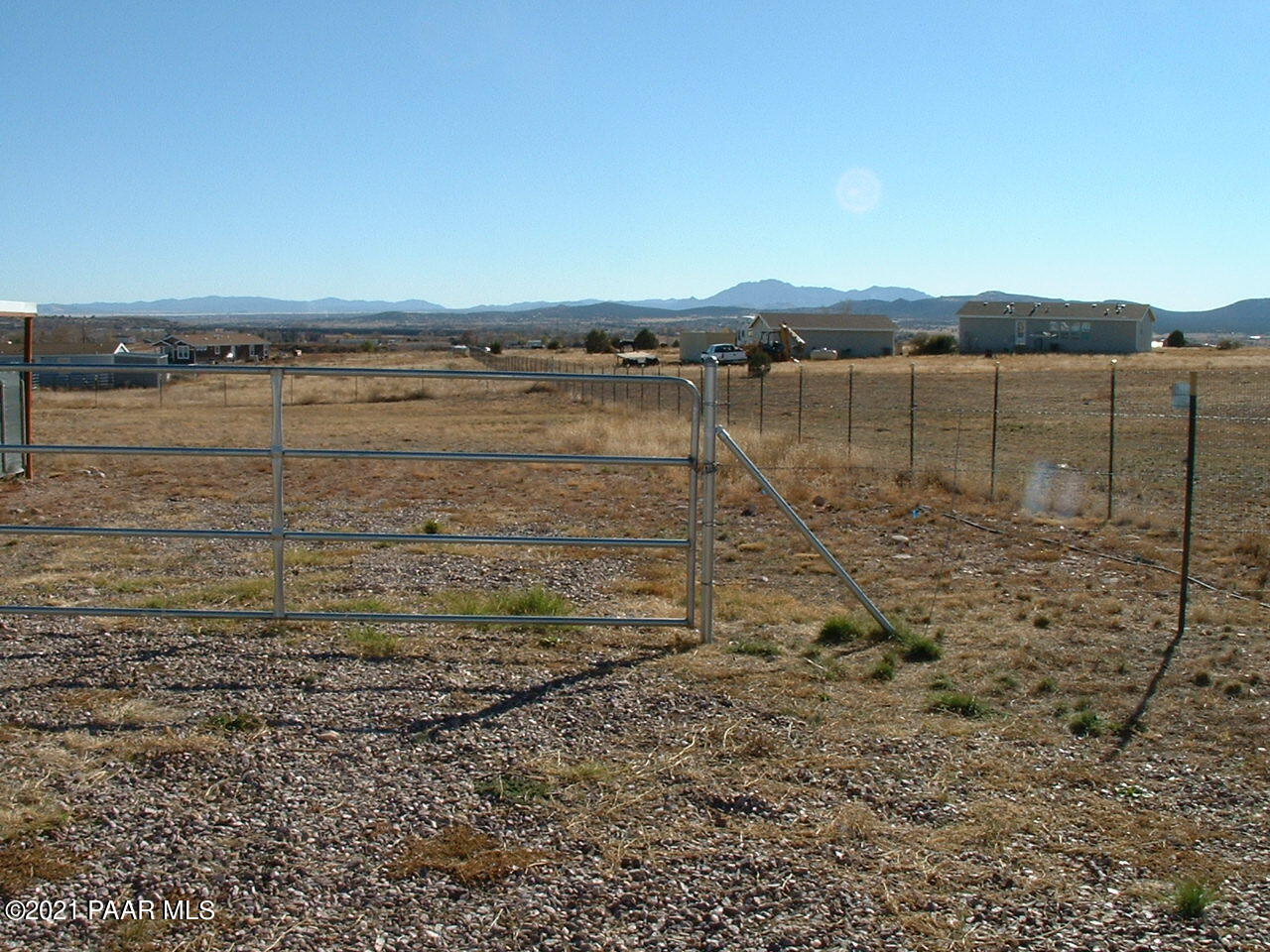 25 West Antelope Run Road Paulden, AZ 86334 - Photo 24 of 27 a view of a dry yard with wooden fence
