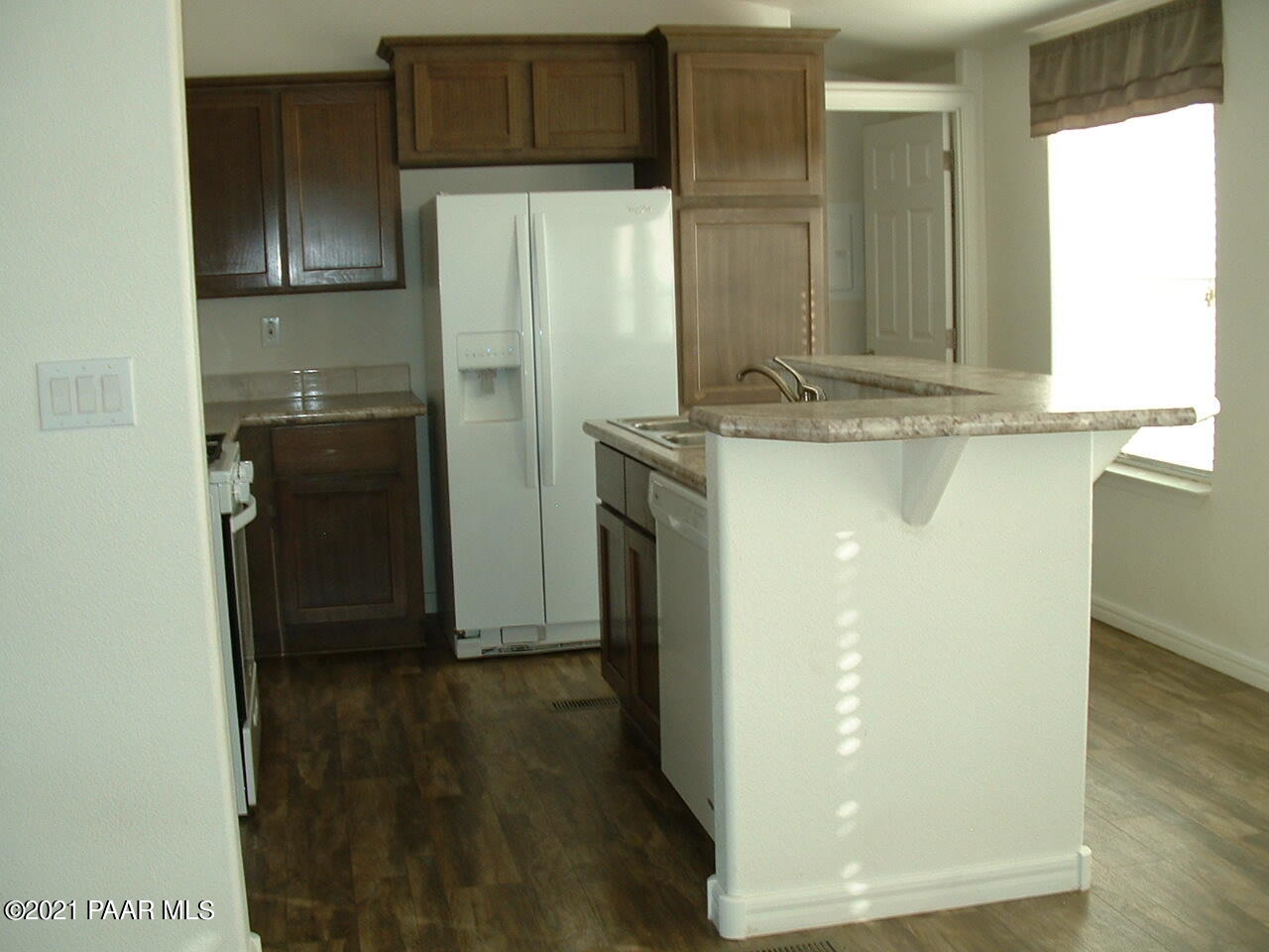 25 West Antelope Run Road Paulden, AZ 86334 - Photo 10 of 27 a kitchen with a refrigerator and a stove