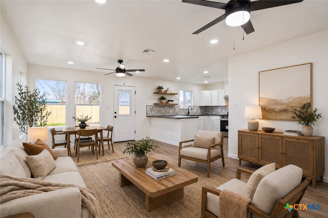 707 South 13th Street Temple, TX 76504 - Photo 5 of 24 a living room with furniture kitchen view and a large window