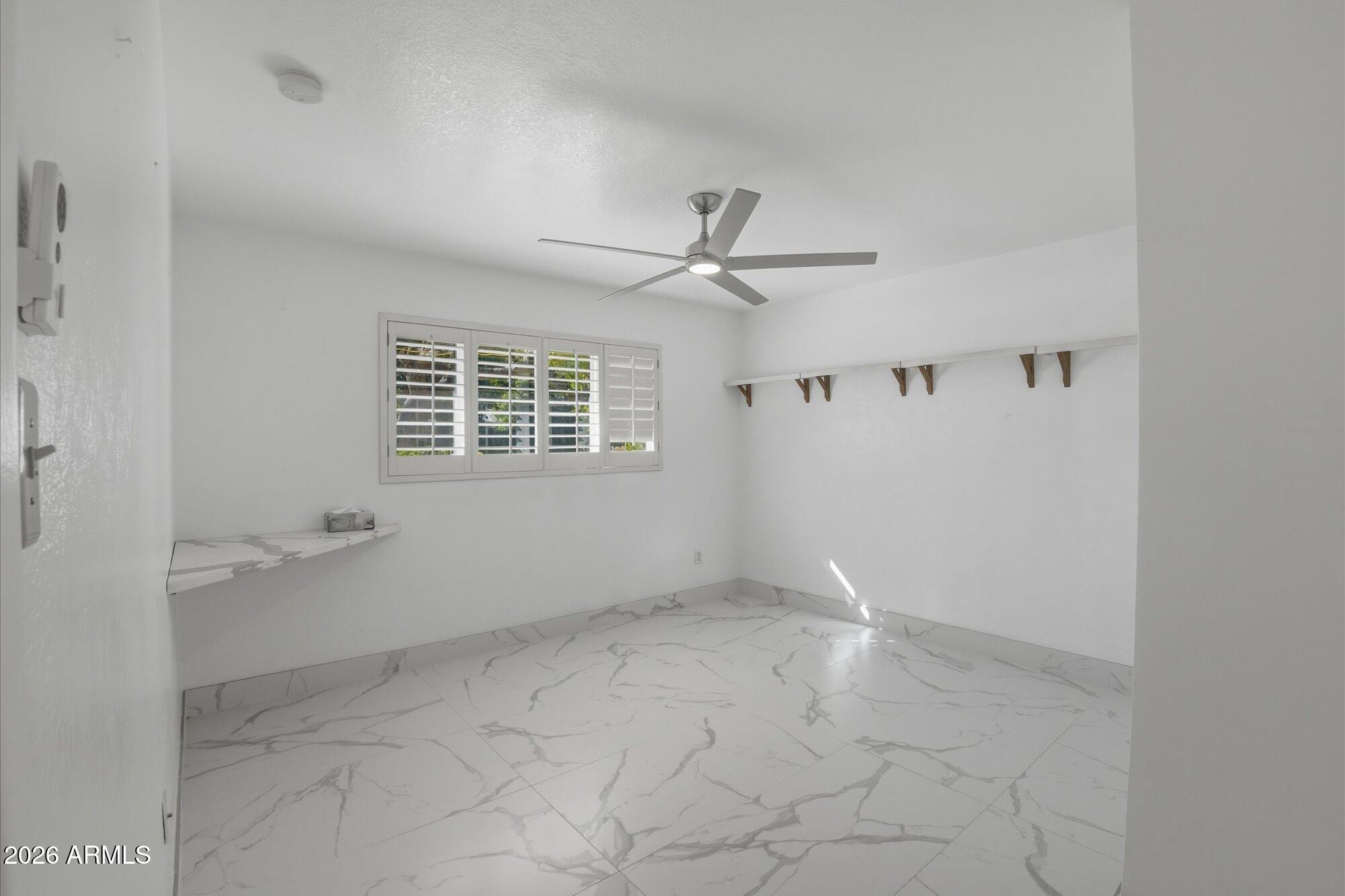 1532 West Loma Lane Phoenix, AZ 85021 - Photo 13 of 19 a view of an empty room with a window
