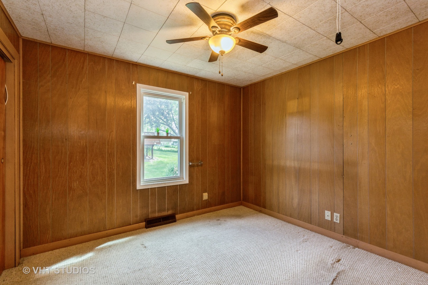 11902 256th Avenue Trevor, WI 53179 - Photo 7 of 10 an empty room with windows and fan