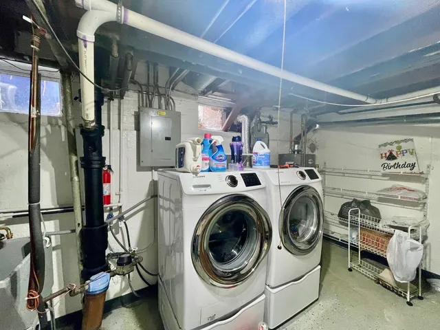 a view of a storage & utility room with washer and dryer