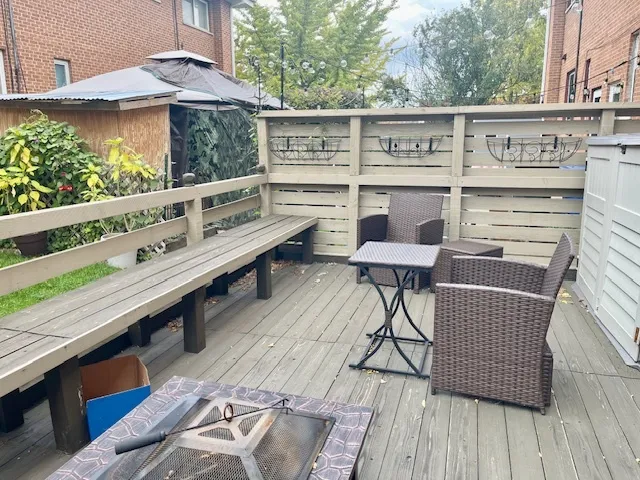 a balcony with wooden floor and furniture