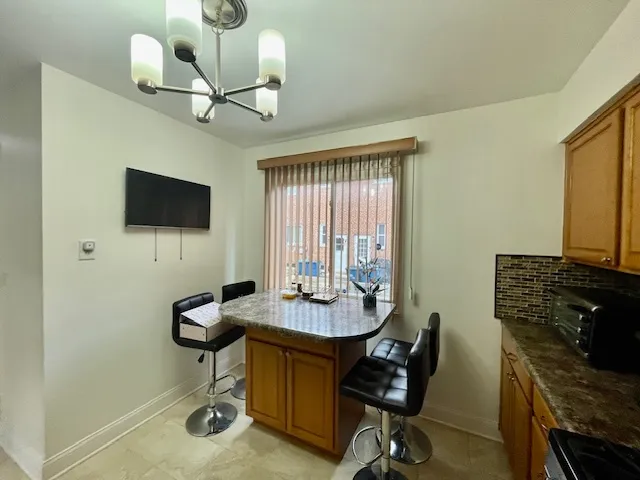 a view of a workspace with furniture