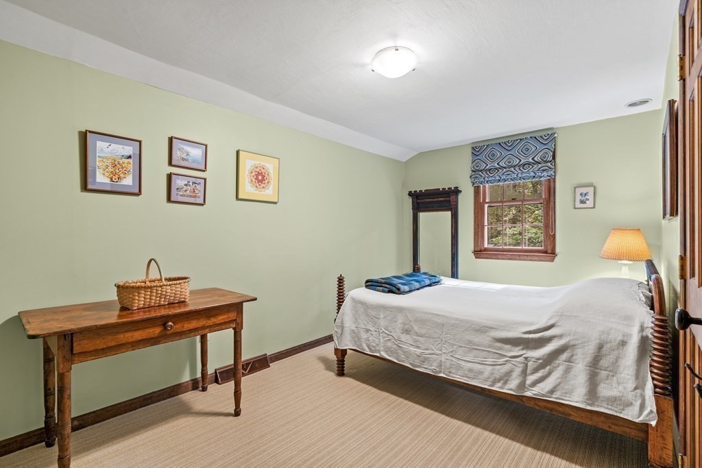35 Turner Road Townsend, MA 01469 - Photo 17 of 29 a bedroom with a bed and paintings on the wall