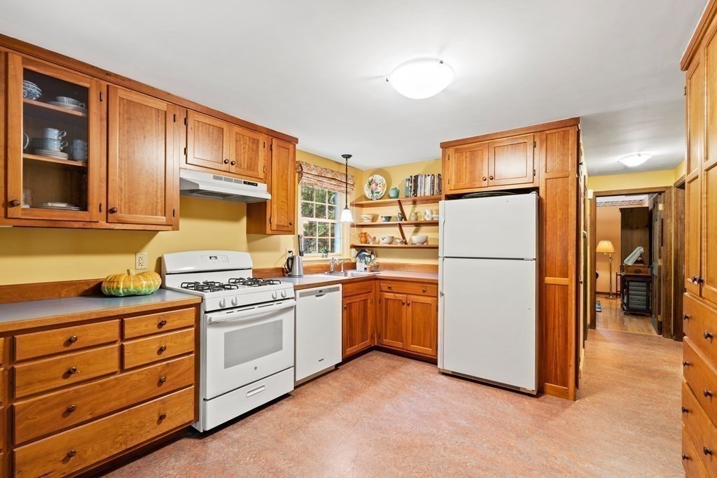 35 Turner Road Townsend, MA 01469 - Photo 5 of 29 a kitchen with cabinets a refrigerator and a stove