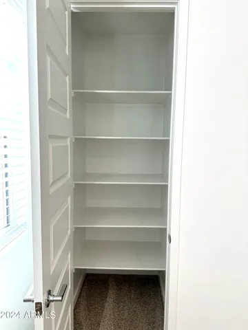 a storage room with washer and dryer