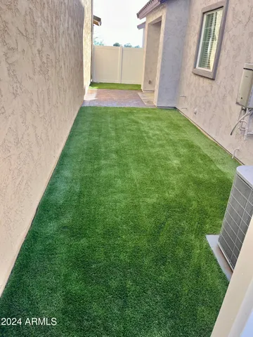 a view of yard with front door and porch
