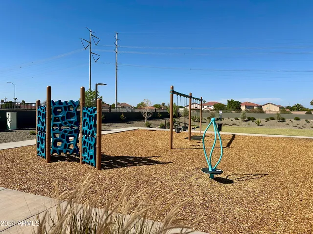 a view of a water with a table and chairs