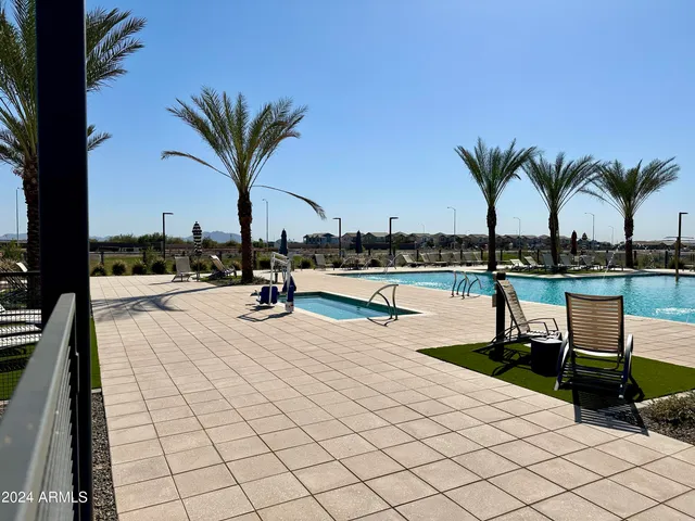 a view of swimming pool with outdoor seating